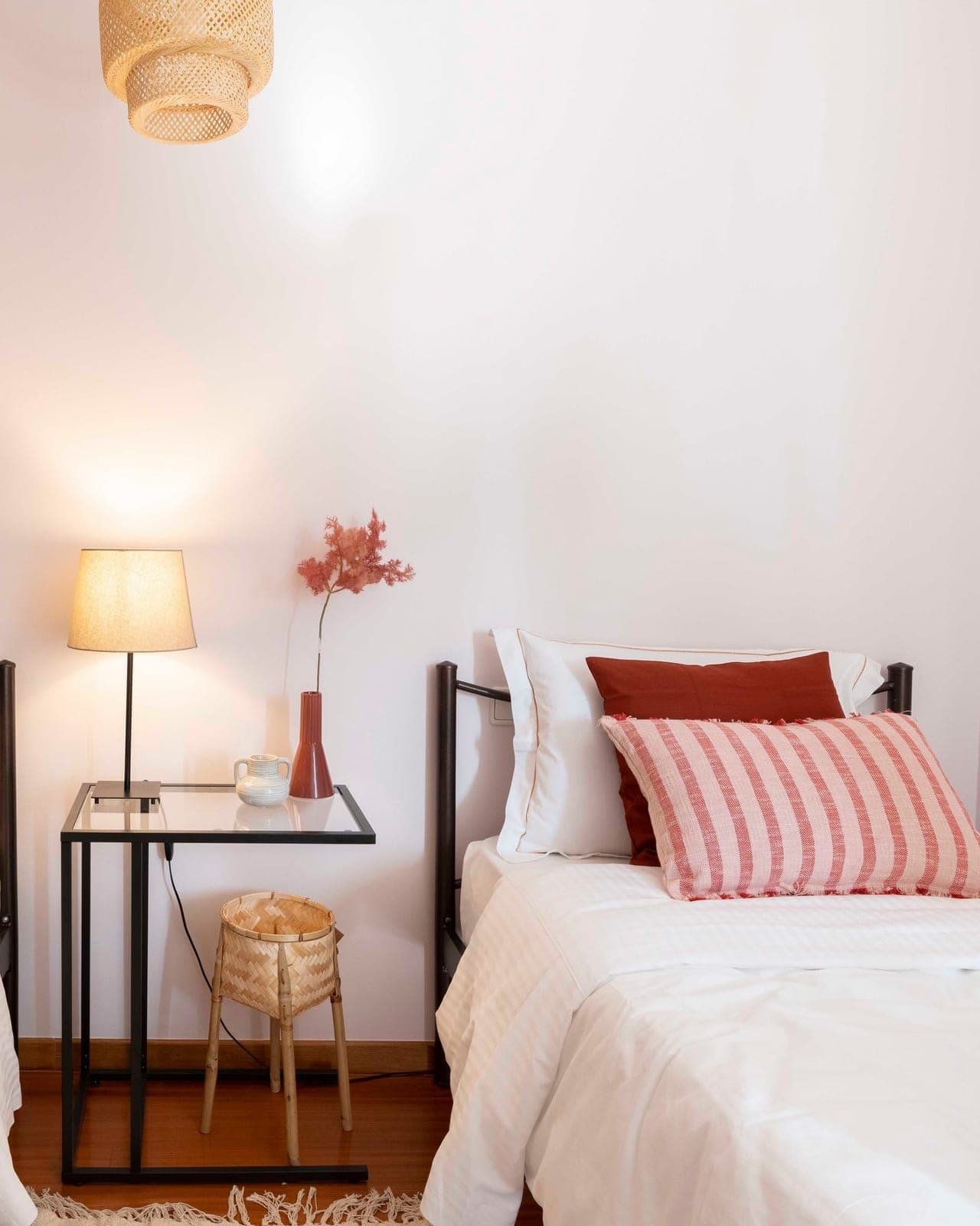 Twin bedroom with rose cushions