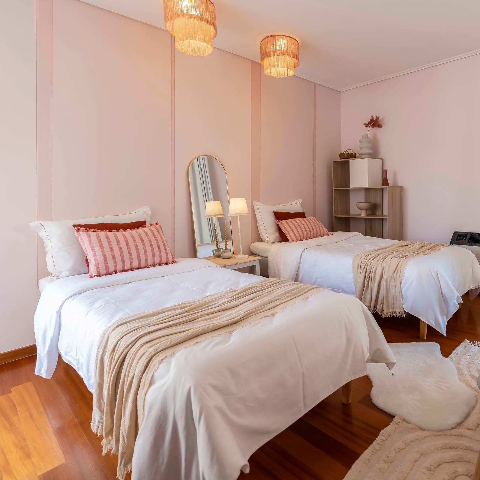 Twin beds with striped linen
